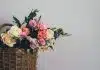 assorted-color flowers on brown wicker basket